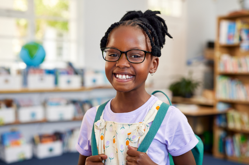 Black girl w glases and backpack